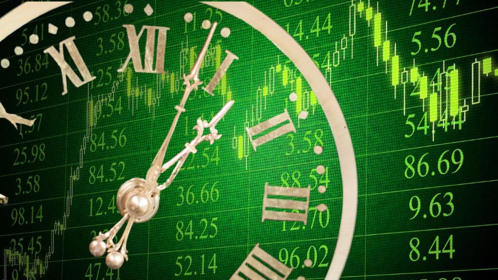 Transparent clock face over a forex price chart, representing the 72 hours of central bank decisions this week