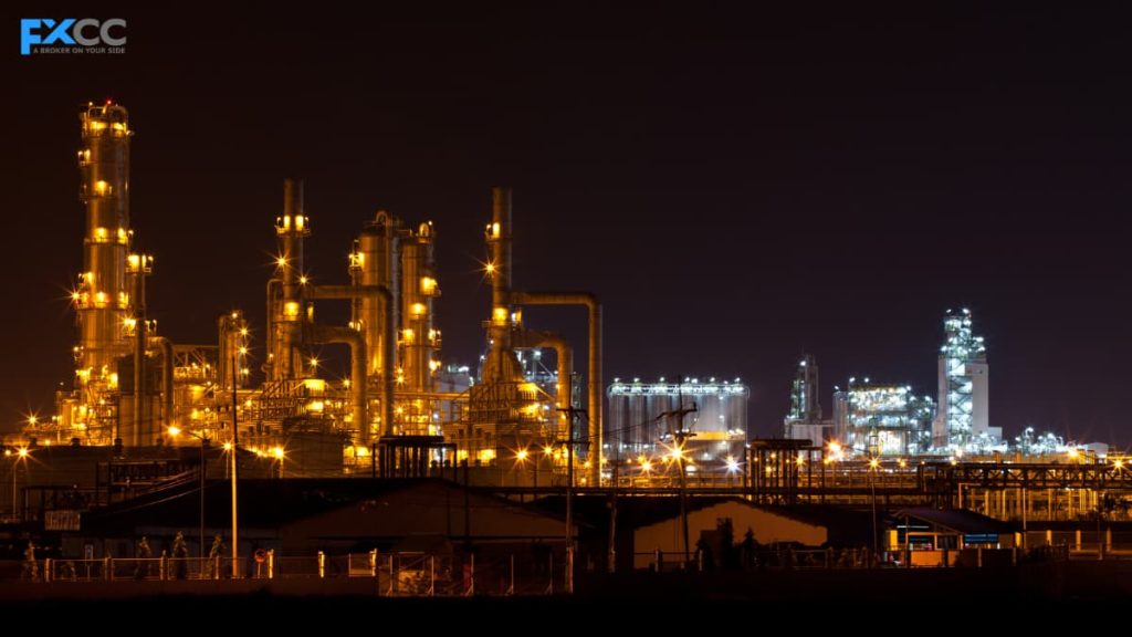 Crude oil refinery lit up at dusk